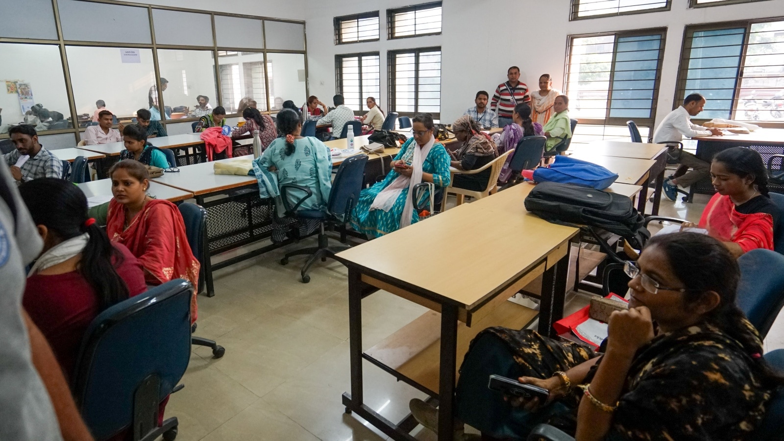 ‘Workload, threat from officials, server issues, anonymous calls at night’: BLOs stage protest at Ahmedabad centre 